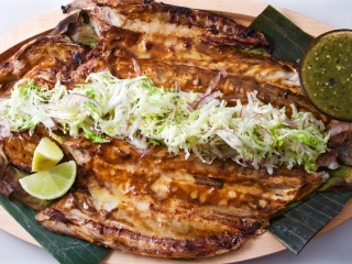 Striped Bass Oaxacan-Style Butterflied Anguilla Farm striped bass, grilled with red chile adobo glaze